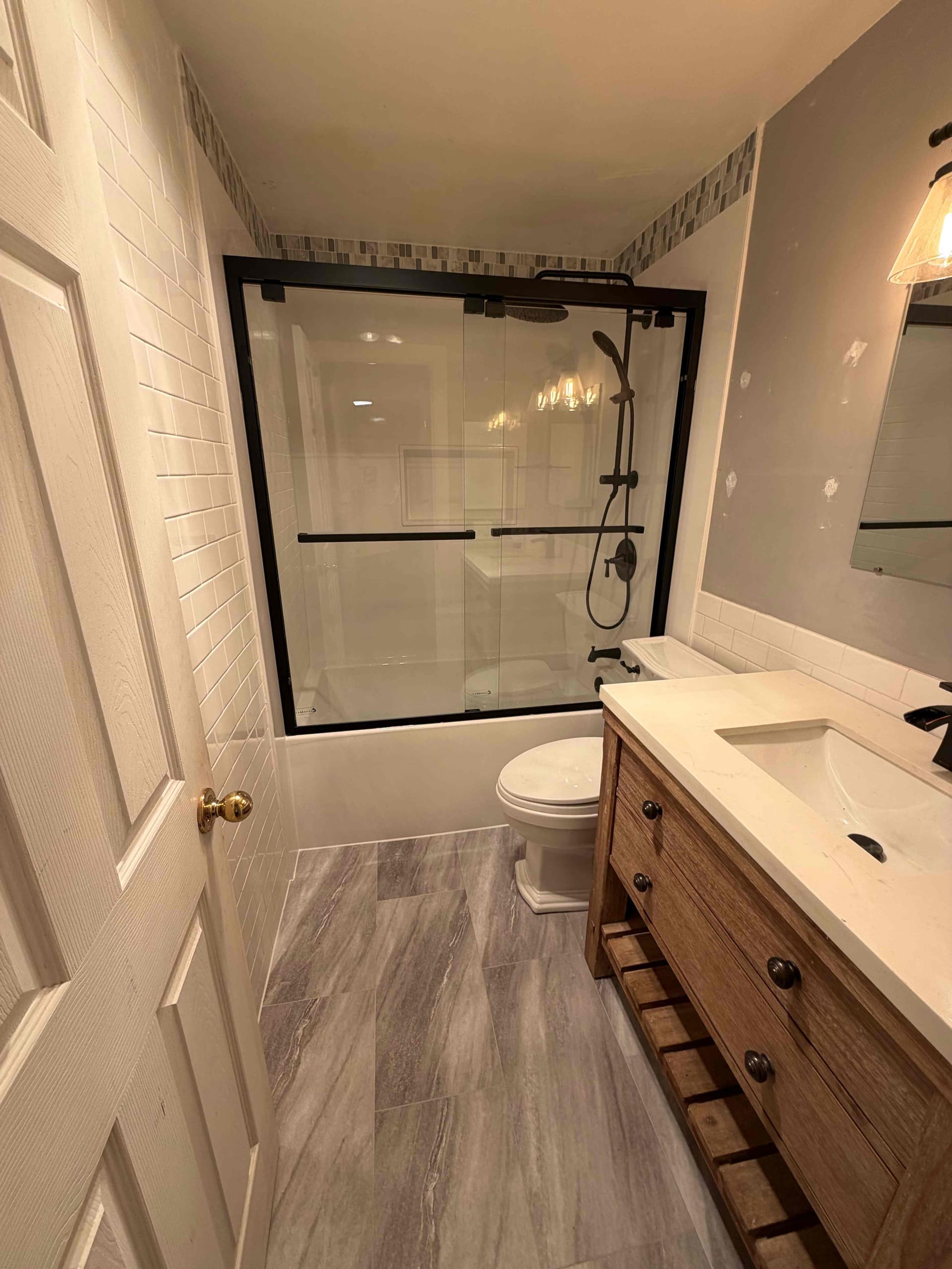 Seattle bathroom remodel with floor-to-ceiling wall panels in a small footprint